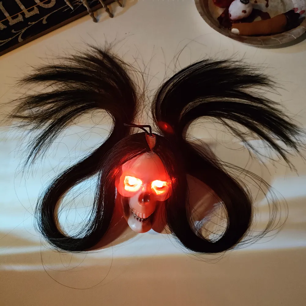 Description Picture 3 of itemHalloween Hanging Ghost Skull with Long Hair Glowing Eyes Terror Skull Ghost House Head Skeleton Props 2023 Halloween Decoration